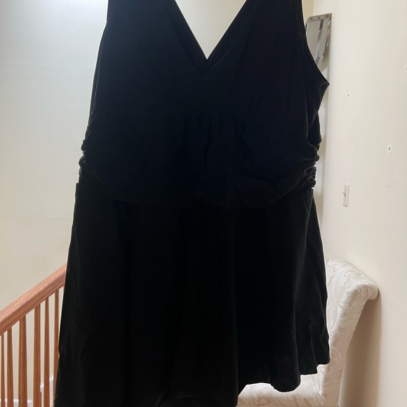Black swimsuit by torrid with ruching and feminine hemline. Worn once - Picture 2 of 3